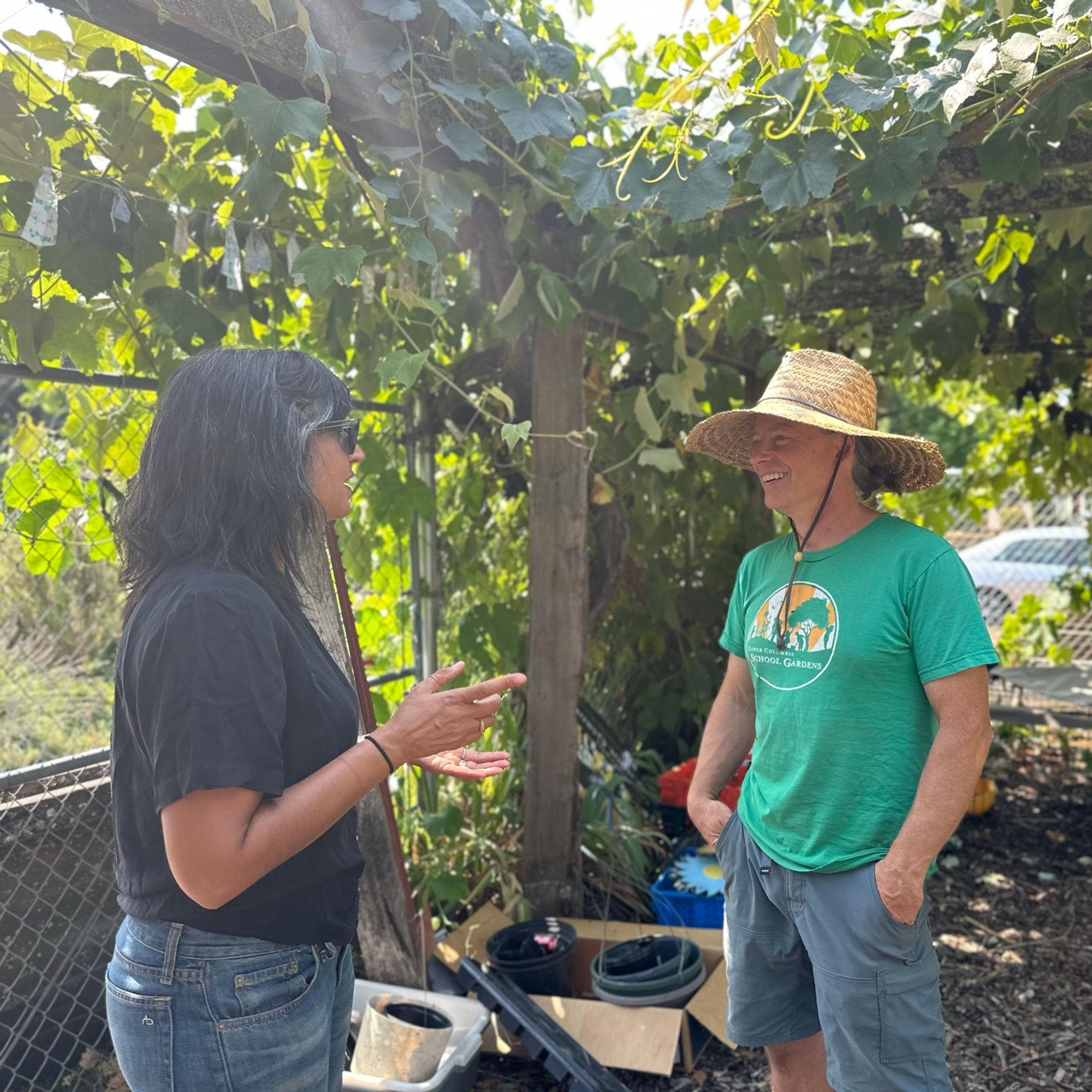 Senior Program Officer, Esra Khalil, talking with Ian Thompson at one of the school gardens in Longview, WA