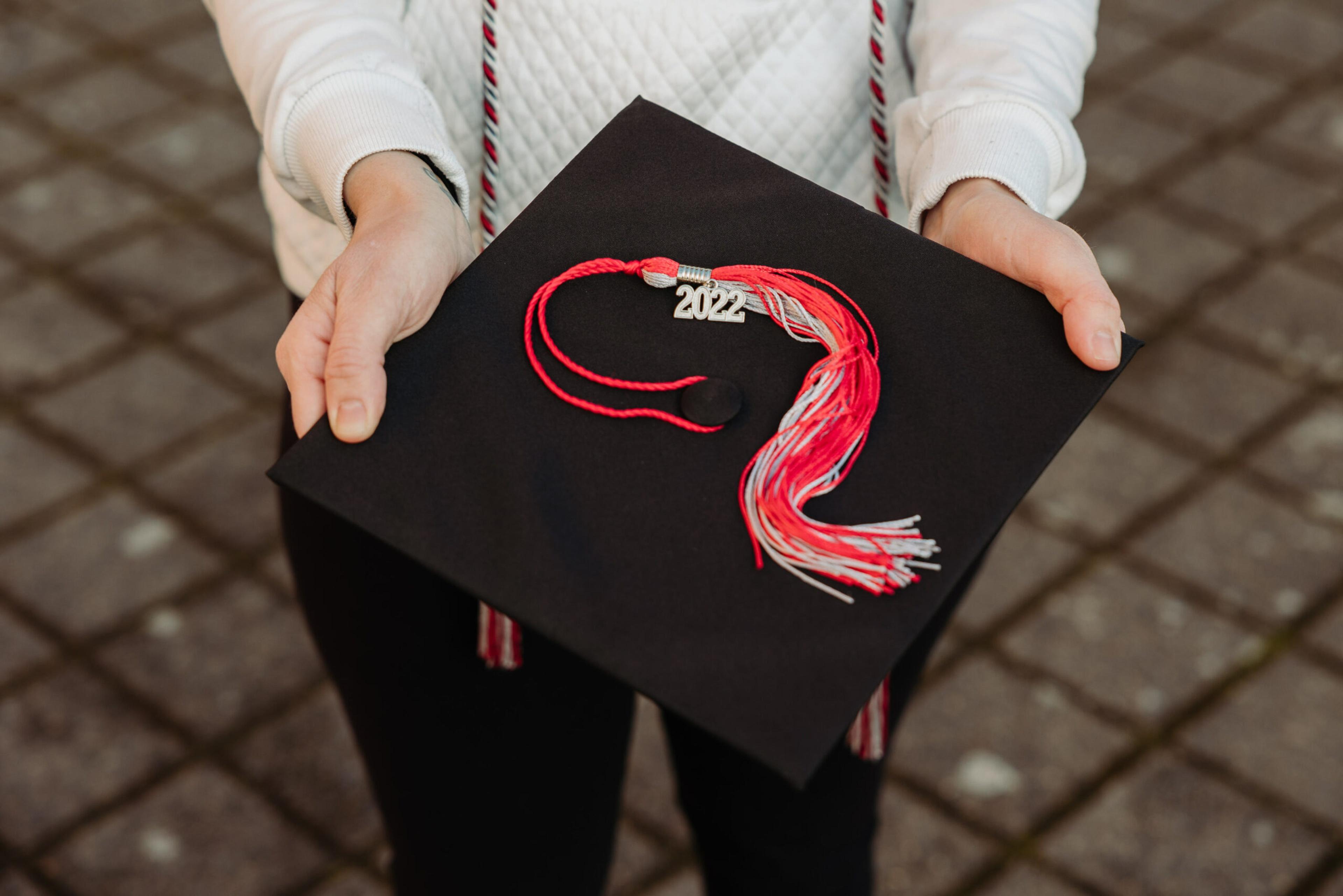 Sally Bovee holding graduation cap