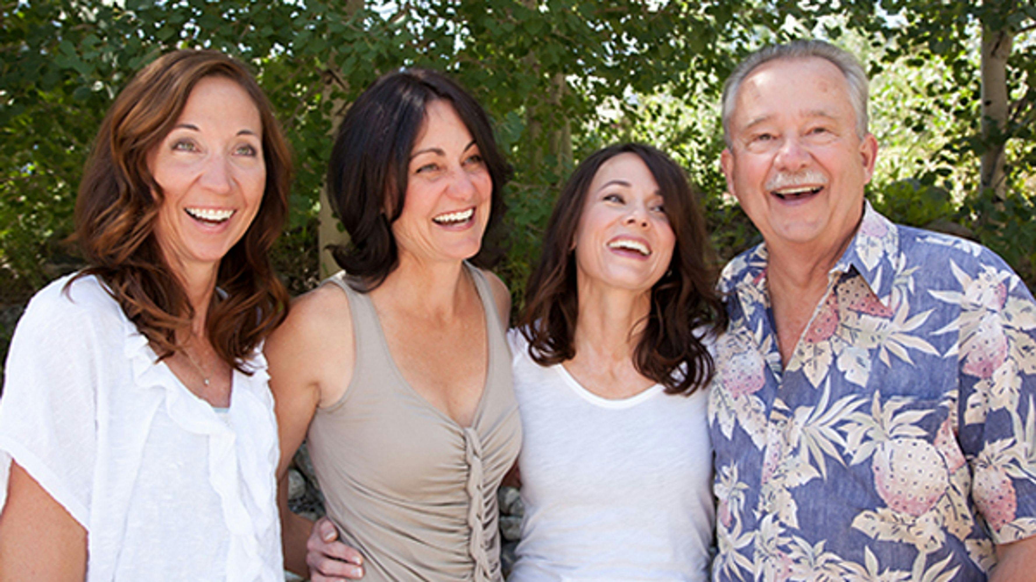 Welch Family of three women and one man smiling and laughing