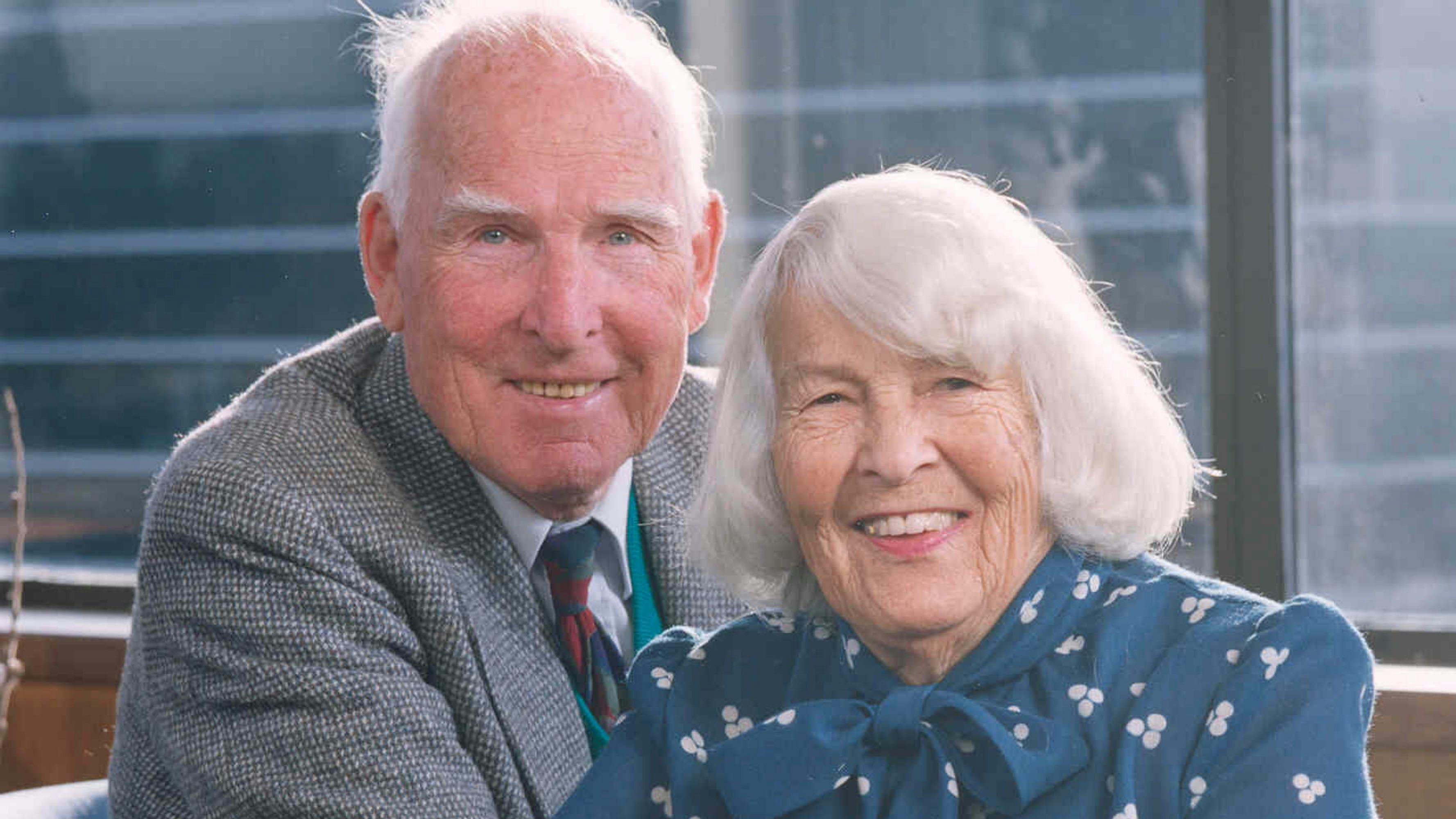 E.W. and Mary Firstenburg sitting next to each other smiling