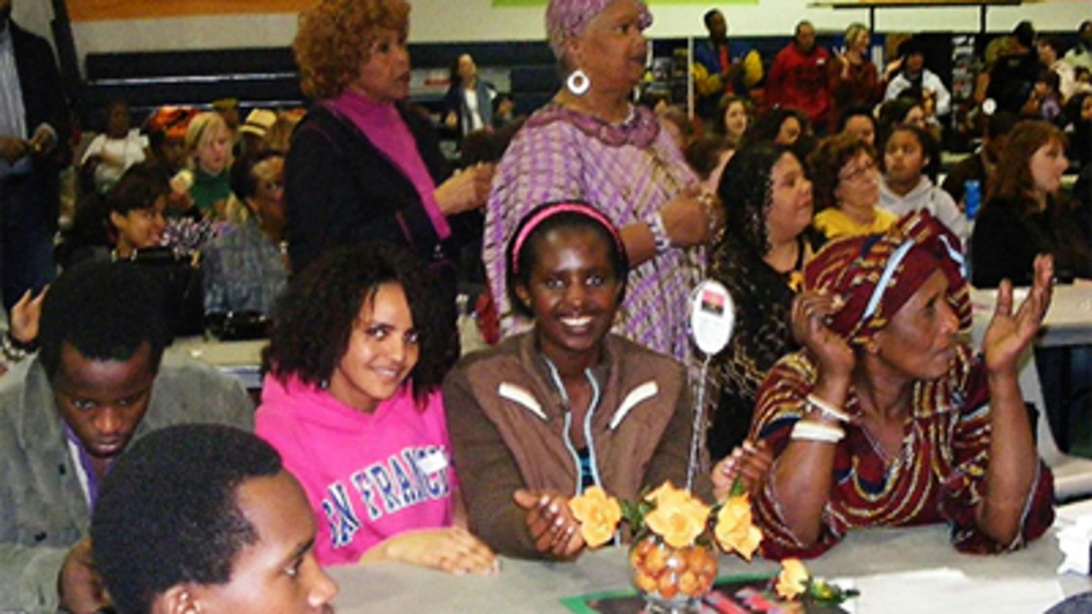 Somali youth and families celebrating at a school event thumbnail