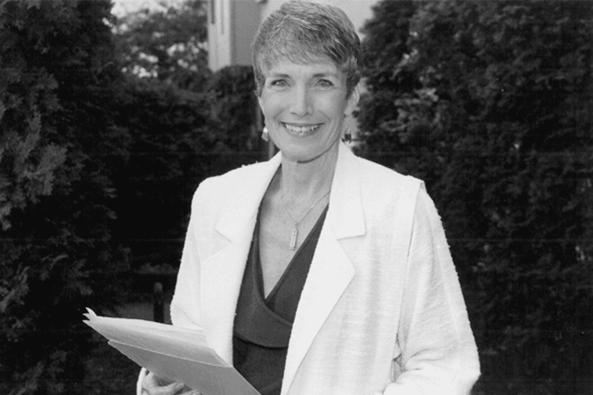 Harriet Wilson, a woman in a business suit smiling at the camera