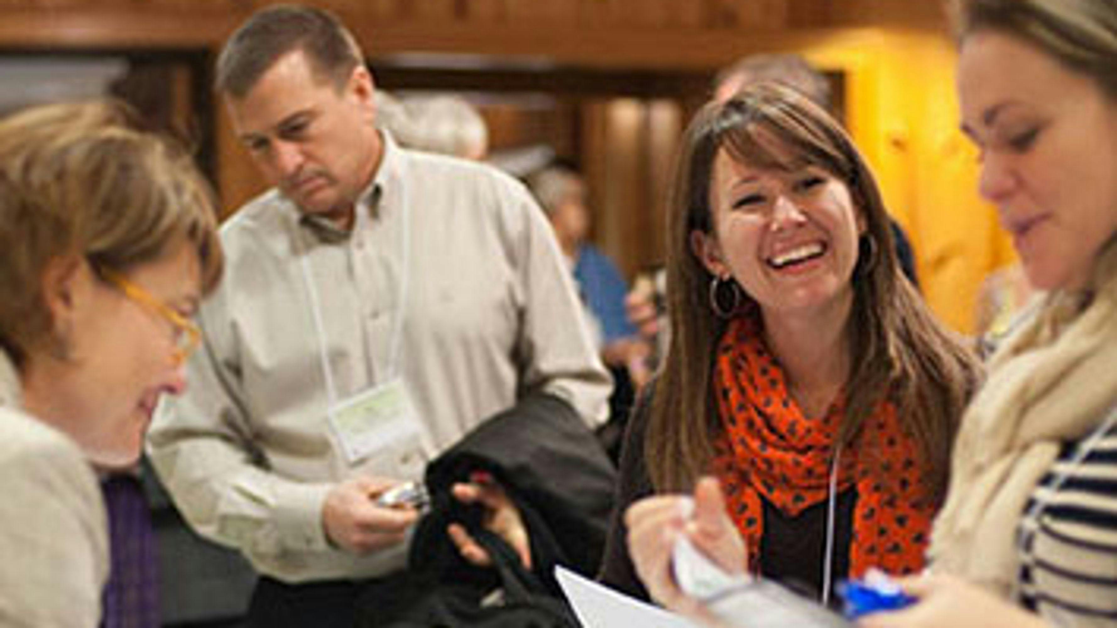 Happy people in a group at a conference